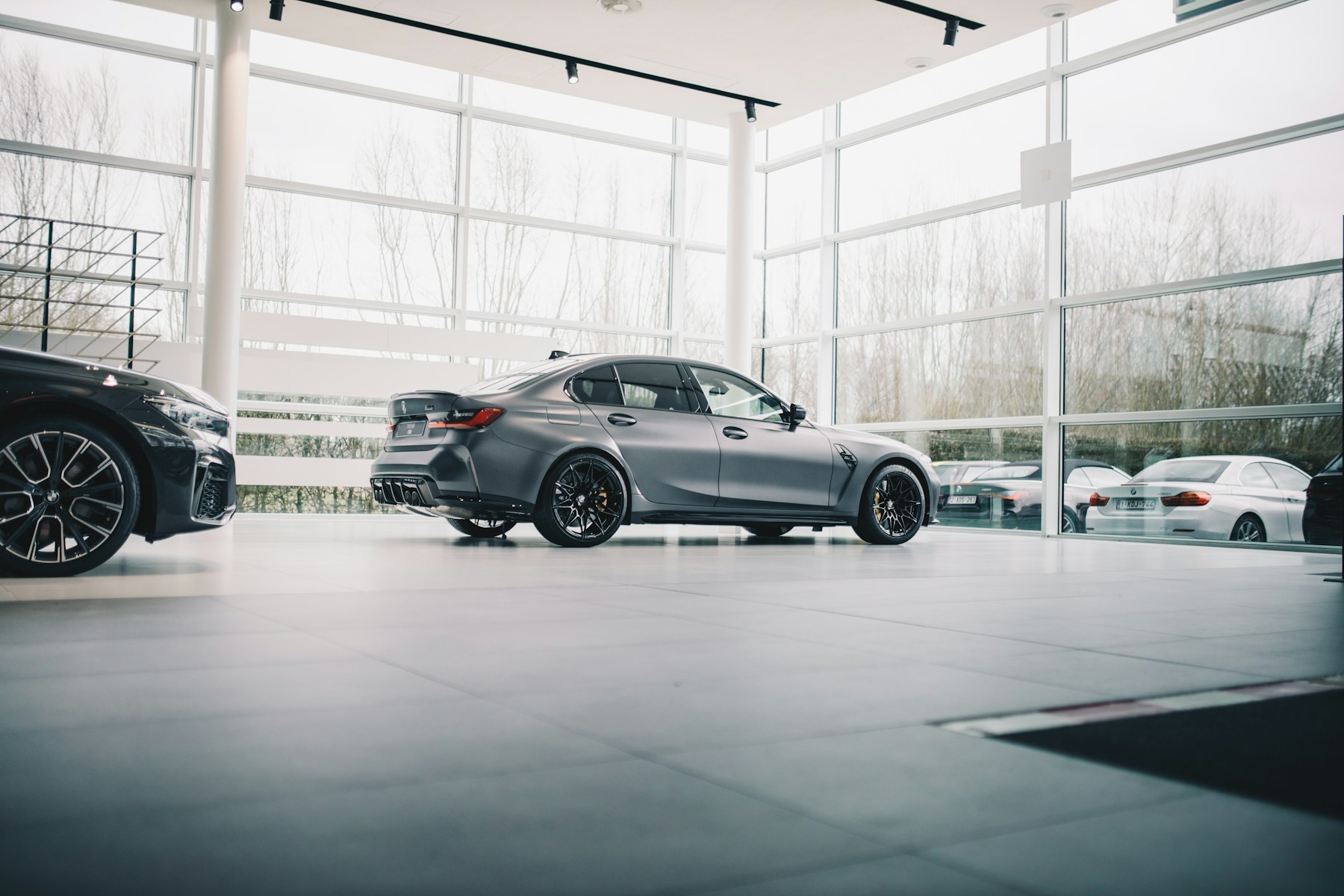 Modern vehicle photographed inside a bright dealership